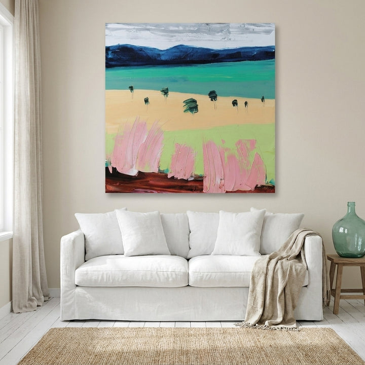 Stretched canvas wall art styled on the wall in a coastal living room