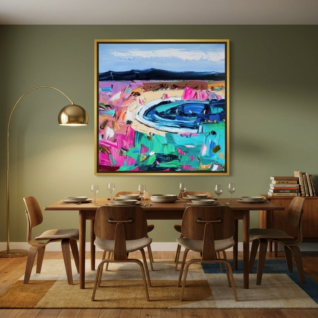 Oversized statement canvas wall art with a gold leaf surround styled on the wall in a mid-century dining room