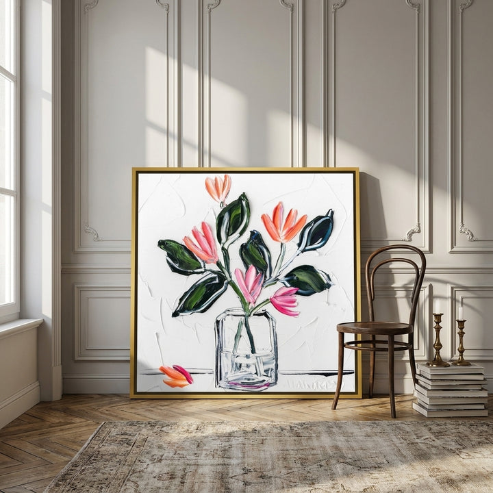 Canvas wall art with a gold leaf surround leaning against the wall in a Parisian bathroom