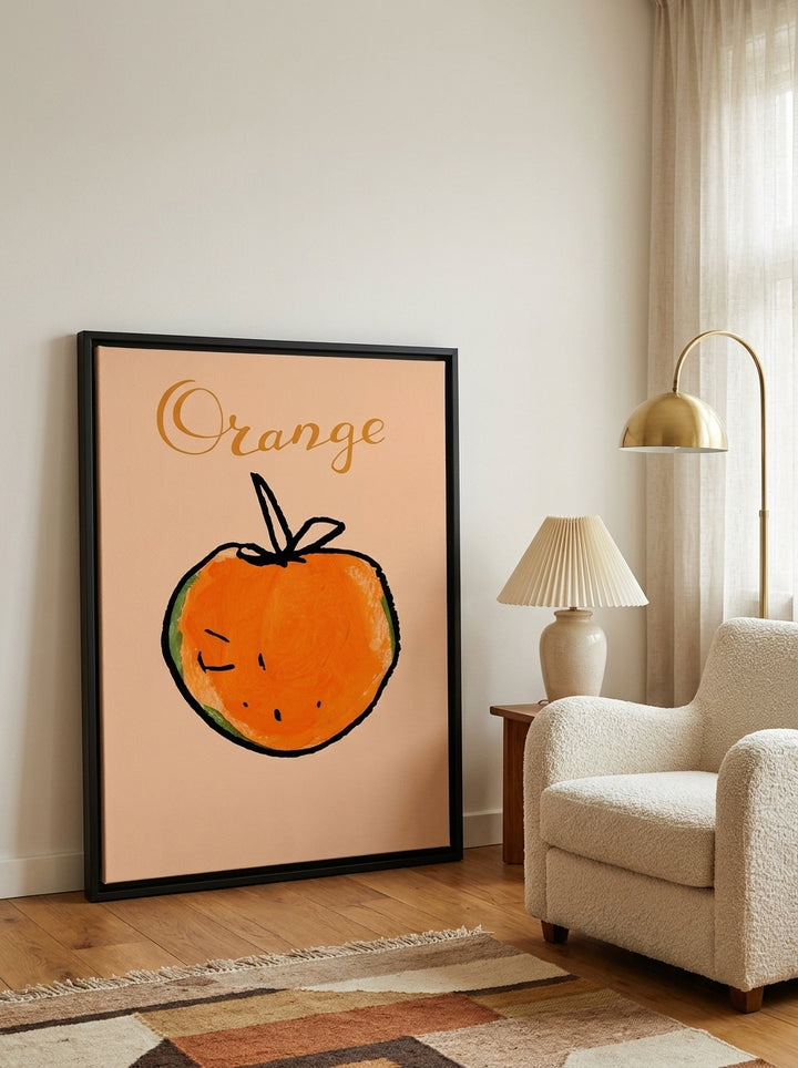 Canvas wall art with a black surround leaning against the wall in a mid-century living room