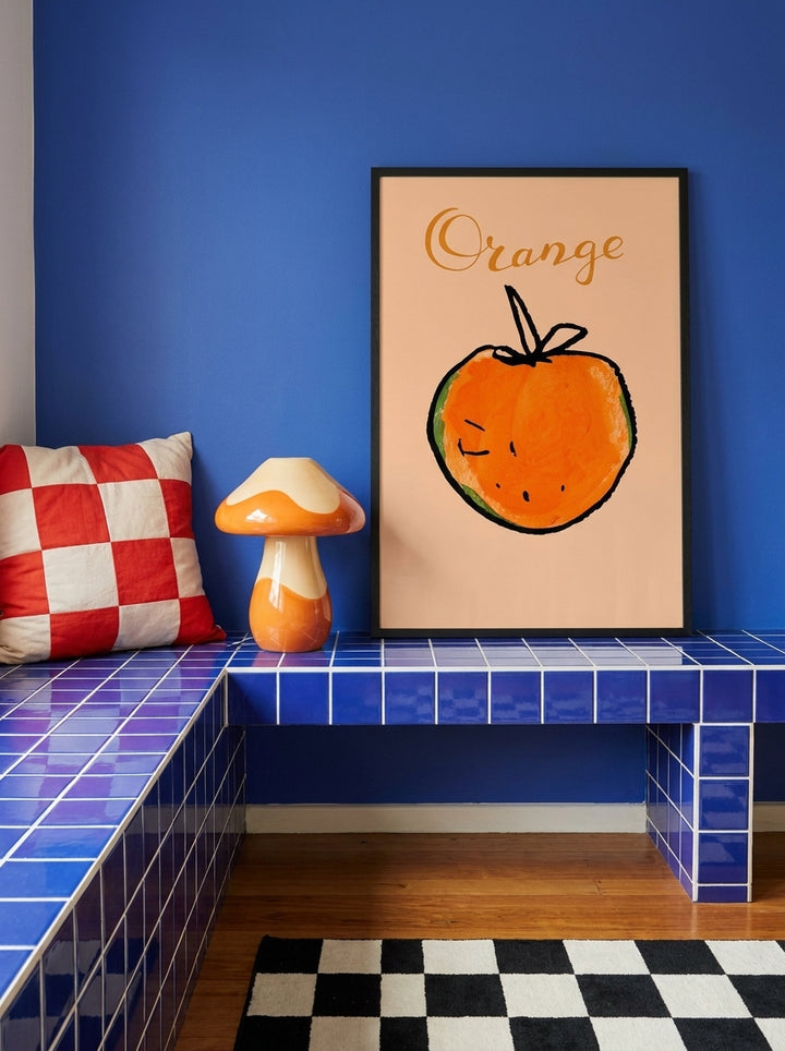 Modern wall art print standing on a kitchen bench in a colourful eclectic kitchen