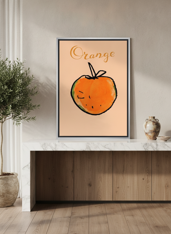 Canvas wall art with a silver leaf surround standing on a kitchen bench in a luxe kitchen