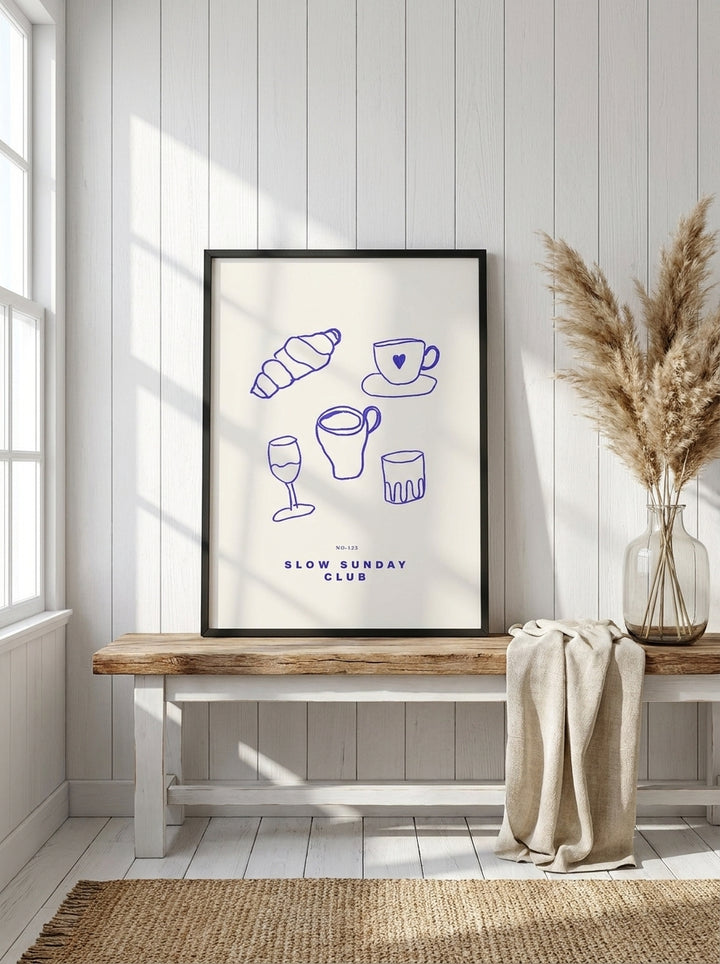 Modern wall art print standing on a kitchen bench in a coastal kitchen