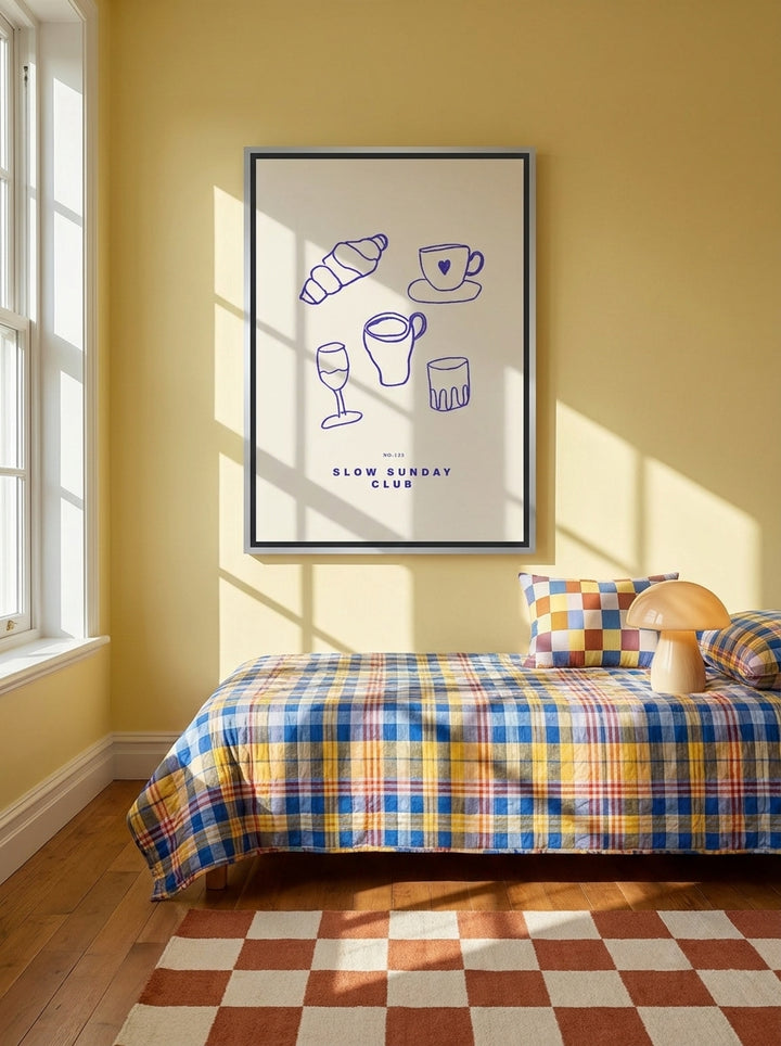 Canvas wall art with a silver leaf surround styled on the wall in a colourful eclectic bedroom