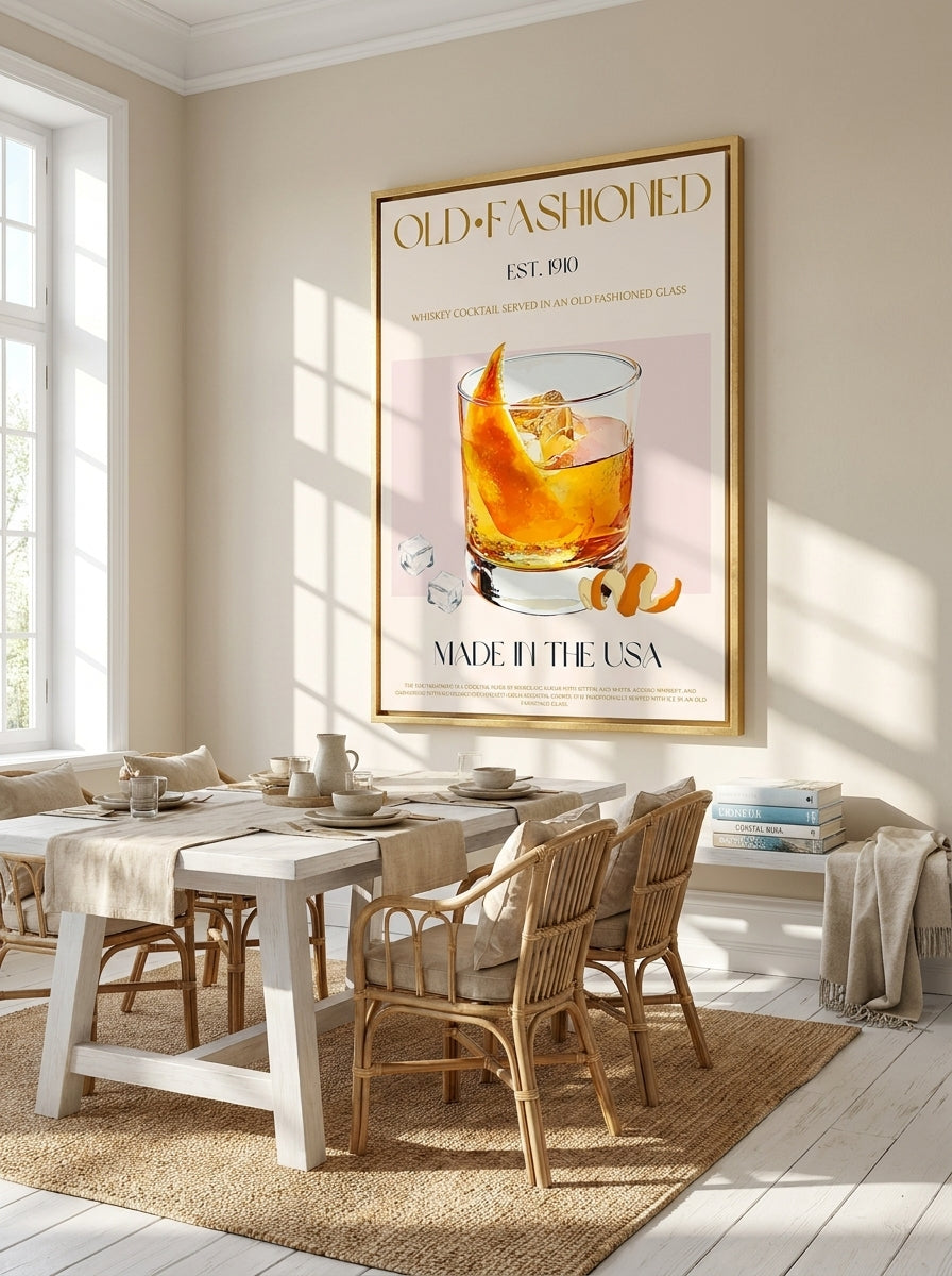Oversized statement canvas wall art with a gold leaf surround styled on the wall in a coastal dining room