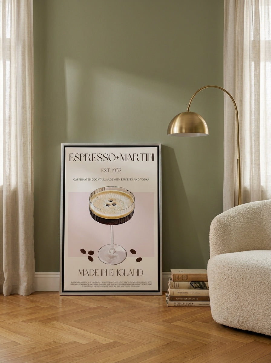 Canvas wall art with a silver leaf surround leaning against the wall in a mid-century living room