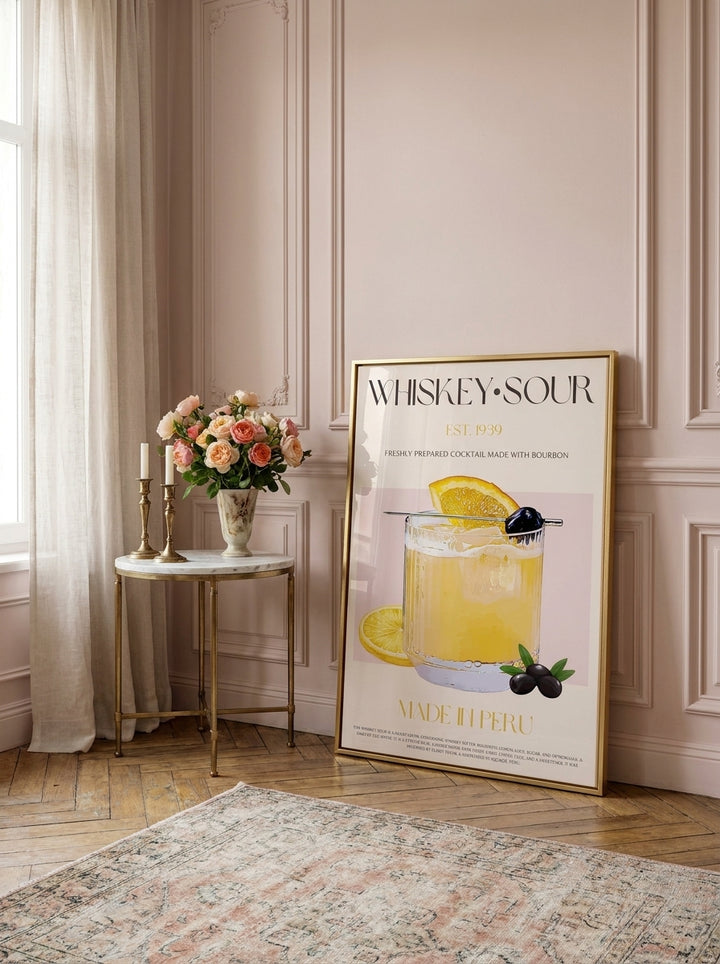 Canvas wall art with a silver leaf surround leaning against the wall in a Parisian bathroom