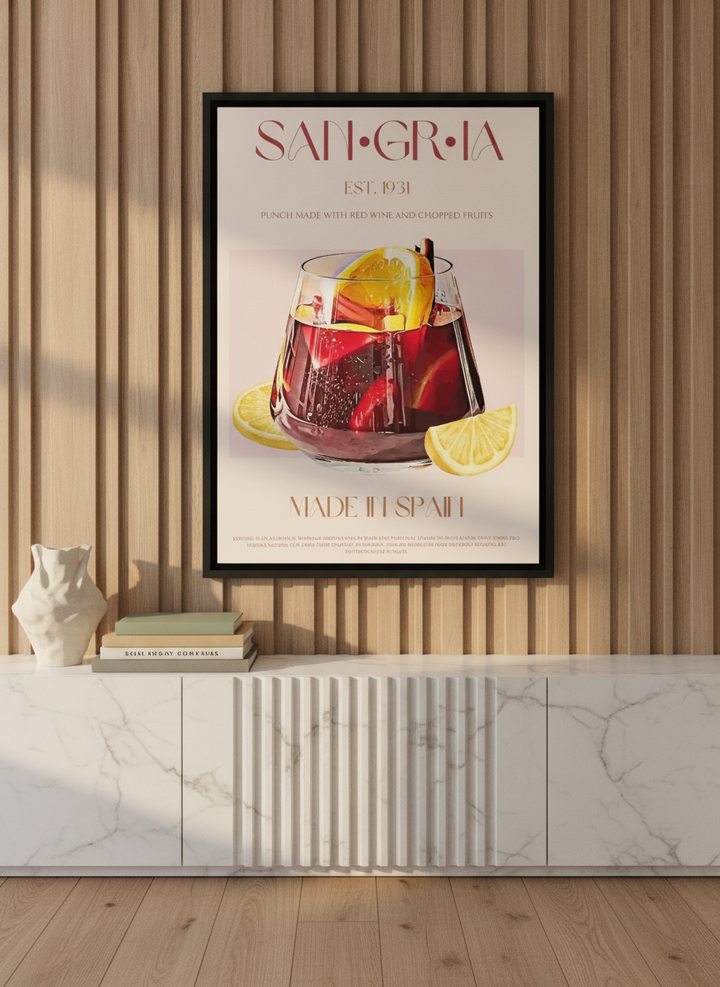 Canvas wall art with a black surround standing on a sideboard in a luxe living room