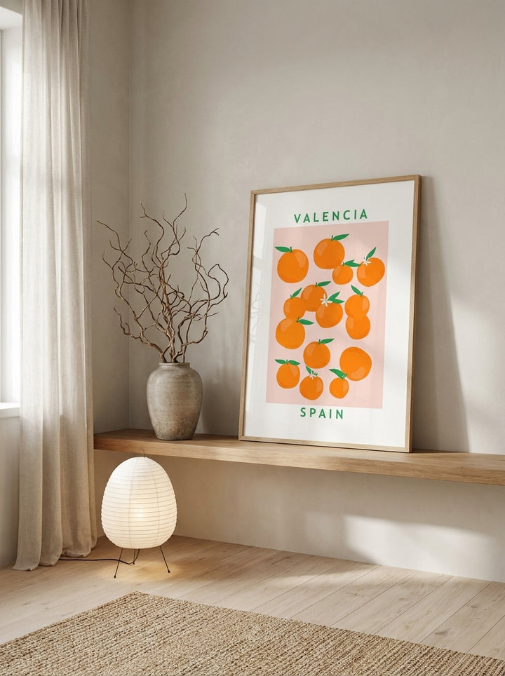 Modern wall art print standing on a shelf in a warm Japandi bathroom