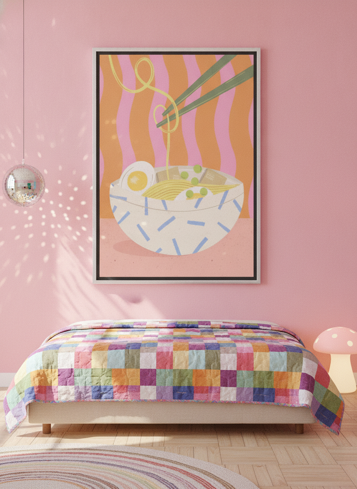 Canvas wall art with a silver leaf surround styled on the wall in a colourful eclectic bedroom