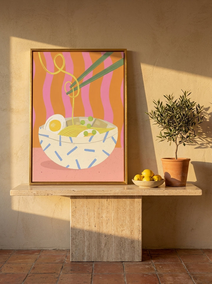 Canvas wall art with a gold leaf surround standing on a console in a Mediterranean living room