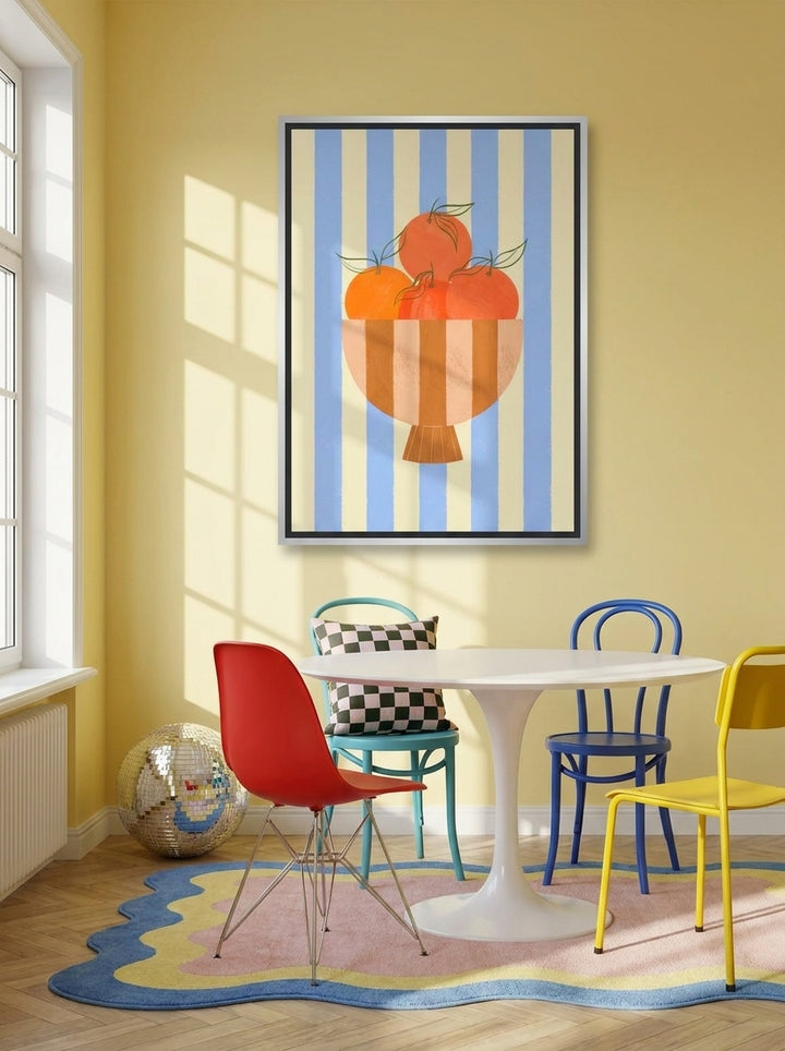 Canvas wall art with a silver leaf surround styled on the wall in a colourful eclectic dining room