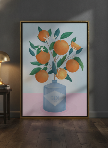 Canvas wall art with a gold leaf surround leaning against the wall in a moody living room