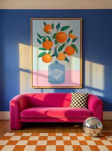 Oversized statement canvas wall art with a natural timber surround styled on the wall in a colourful eclectic living room