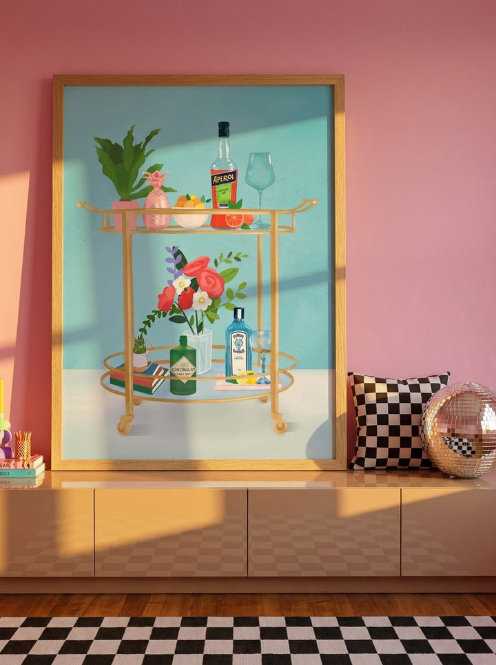 Modern wall art print standing on a sideboard in a colourful eclectic bedroom