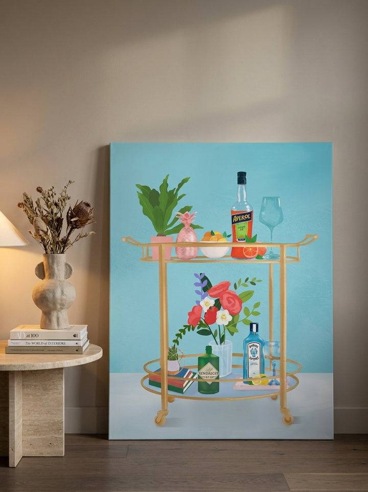 Stretched canvas wall art leaning against the wall in a luxe living room