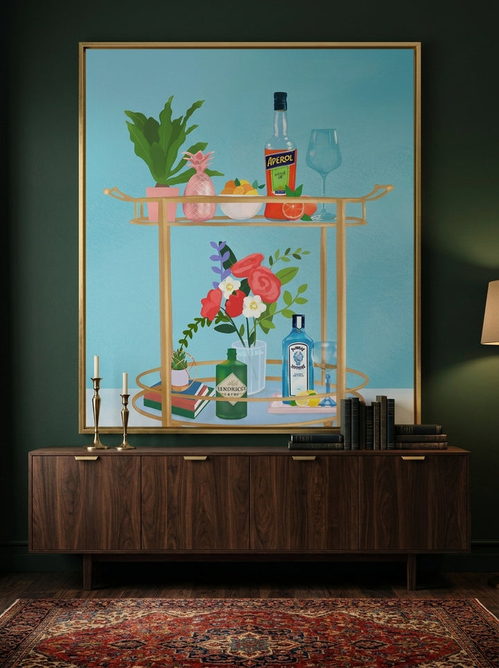 Oversized statement canvas wall art with a gold leaf surround styled on the wall in a moody living room