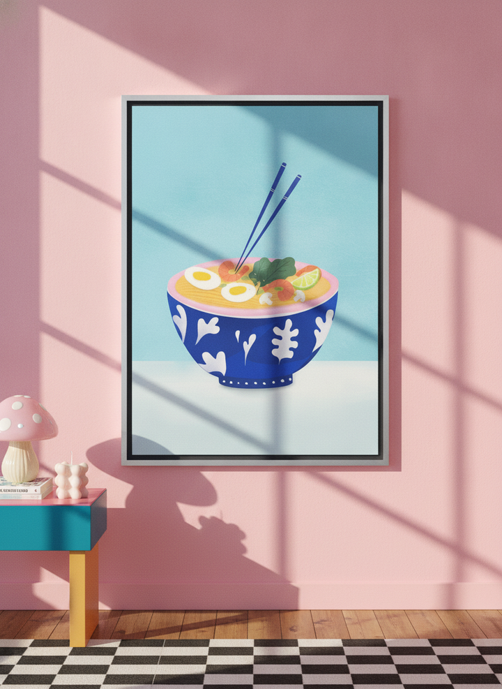 Canvas wall art with a silver leaf surround standing on a side table in a colourful eclectic living room