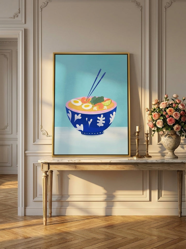 Canvas wall art with a gold leaf surround standing on a console in a Parisian living room