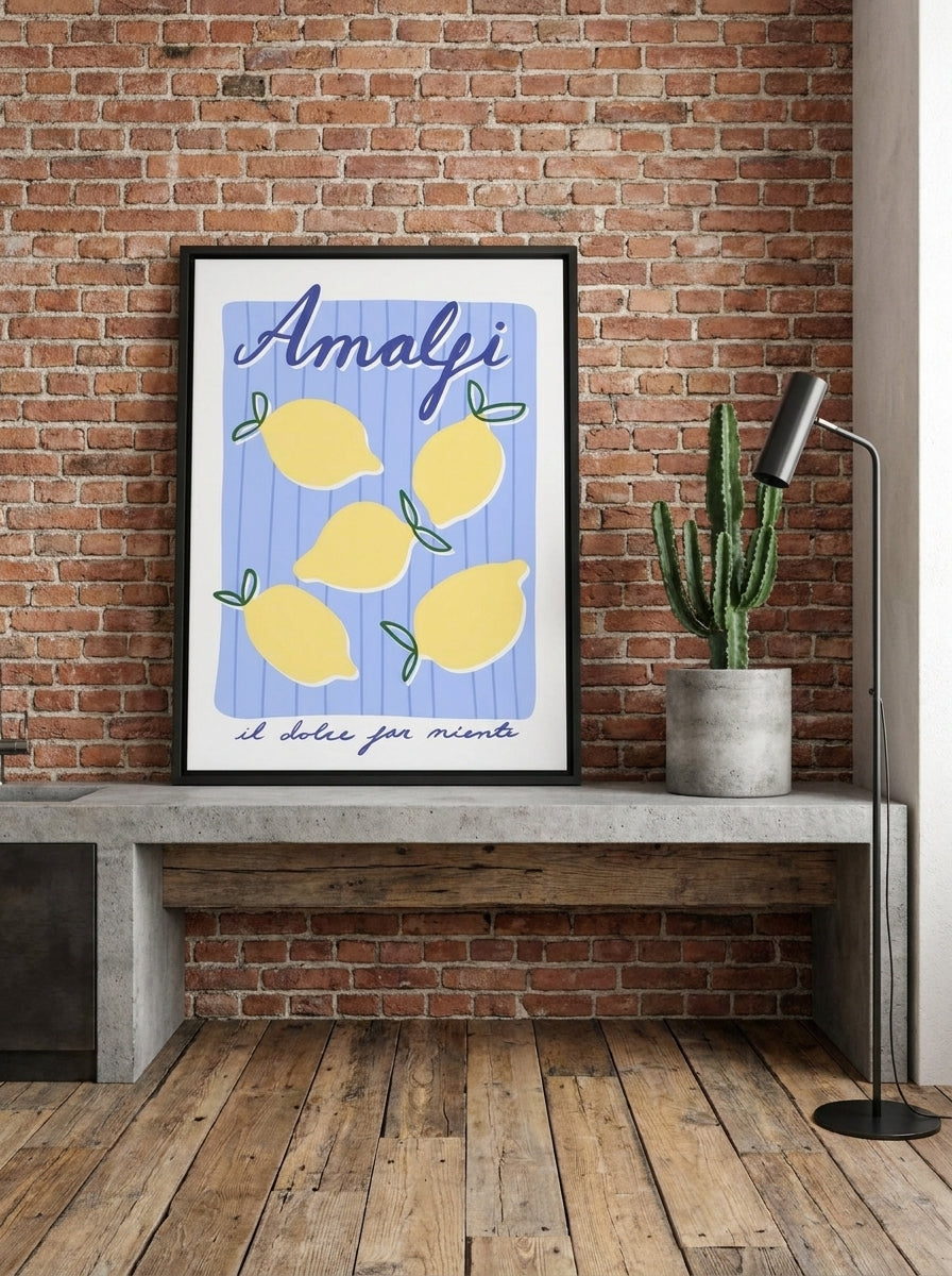 Canvas wall art with a black surround standing on a kitchen bench in an industrial loft kitchen