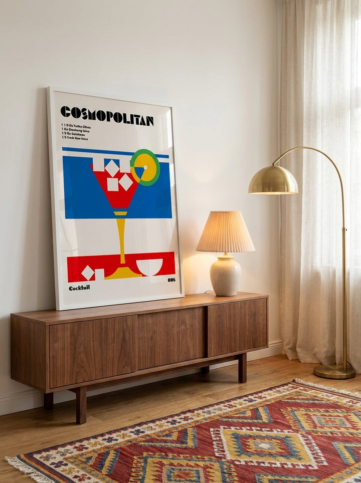 Modern wall art print standing on a sideboard in a mid-century living room