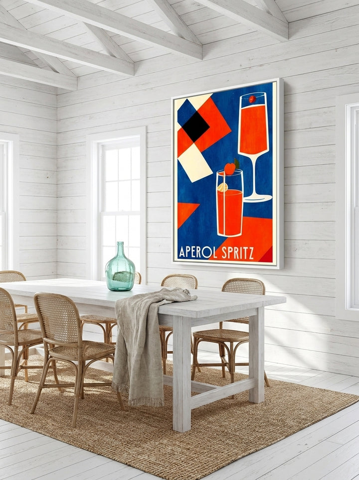Oversized statement canvas wall art with a white surround styled on the wall in a coastal dining room