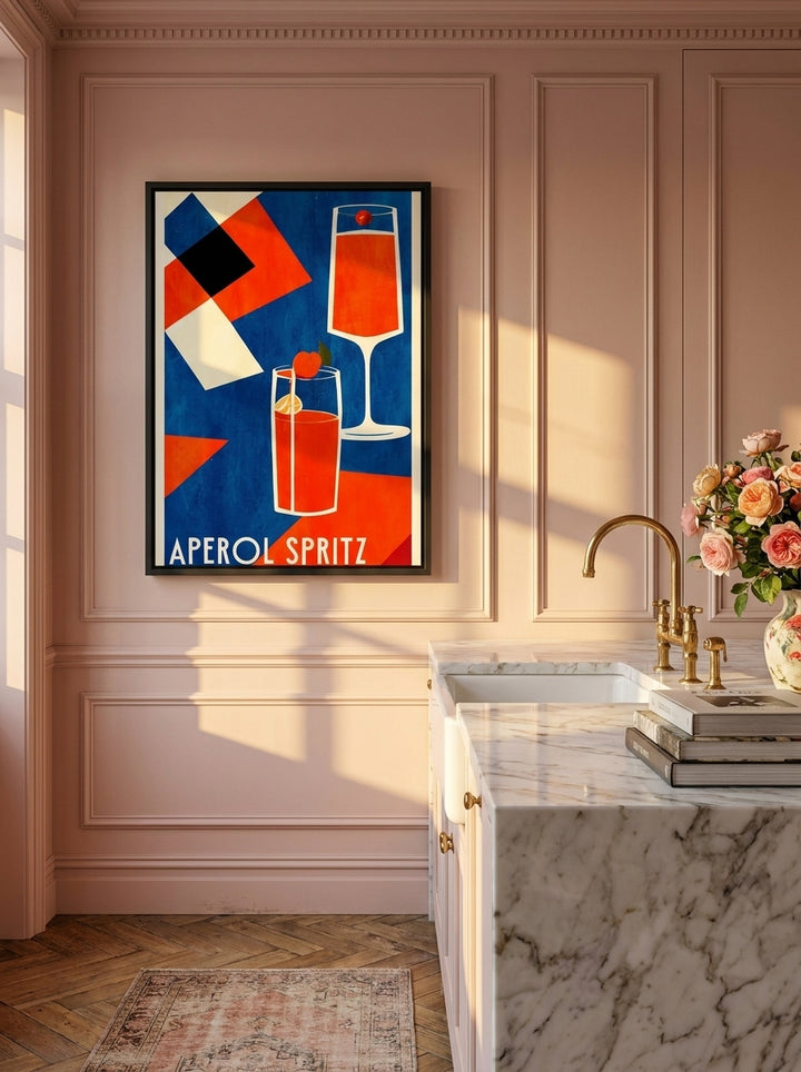 Canvas wall art with a black surround styled on the wall in a Parisian kitchen