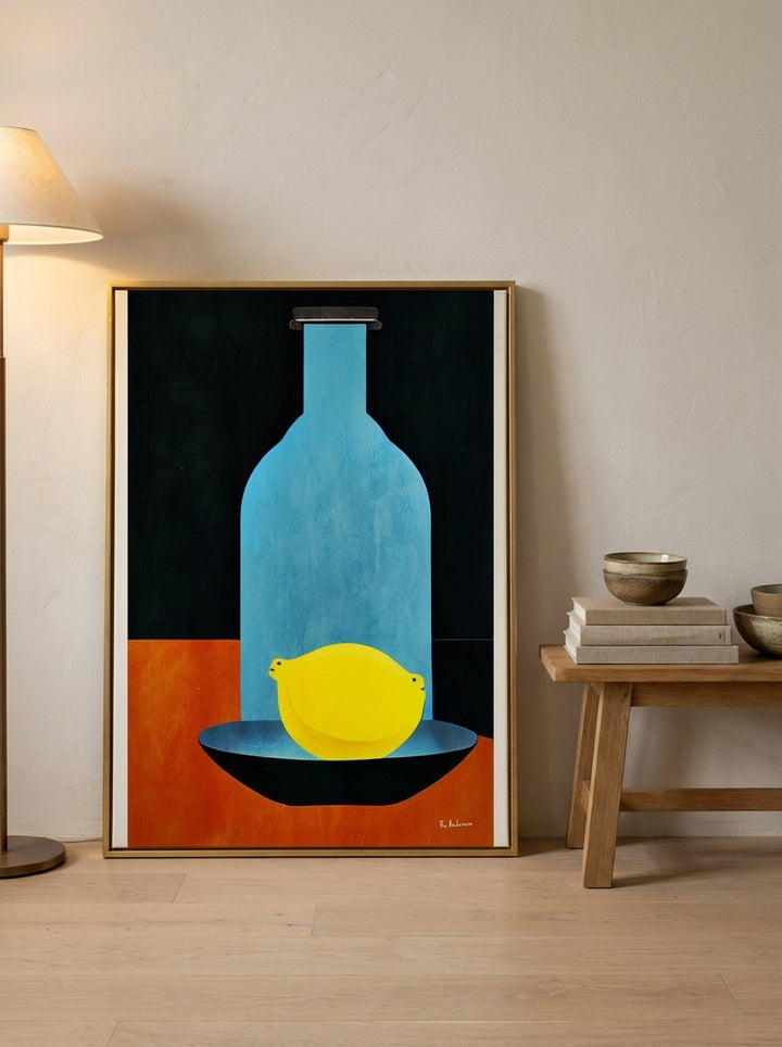 Canvas wall art with a gold leaf surround leaning against the wall in a warm Japandi living room