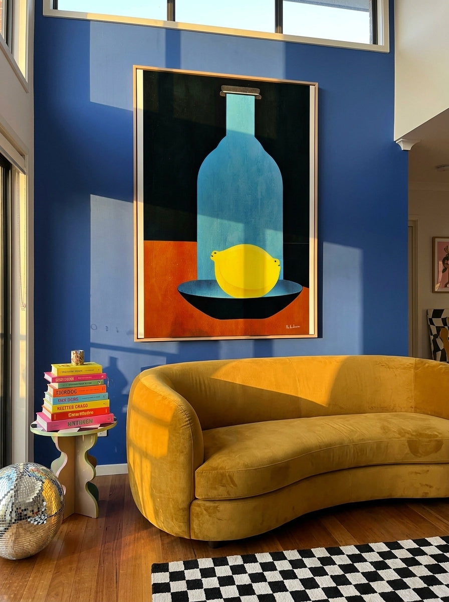 Oversized statement canvas wall art with a natural timber surround styled on the wall in a colourful eclectic living room