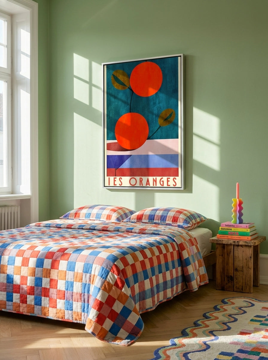 Canvas wall art with a silver leaf surround styled on the wall in a colourful eclectic bedroom
