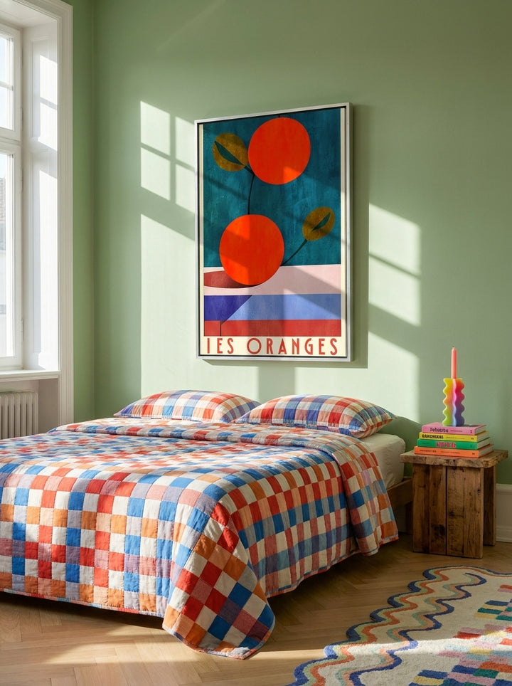 Canvas wall art with a silver leaf surround styled on the wall in a colourful eclectic bedroom