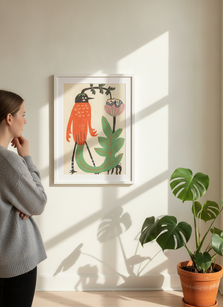 Person holding modern wall art print in a bright Scandinavian living room