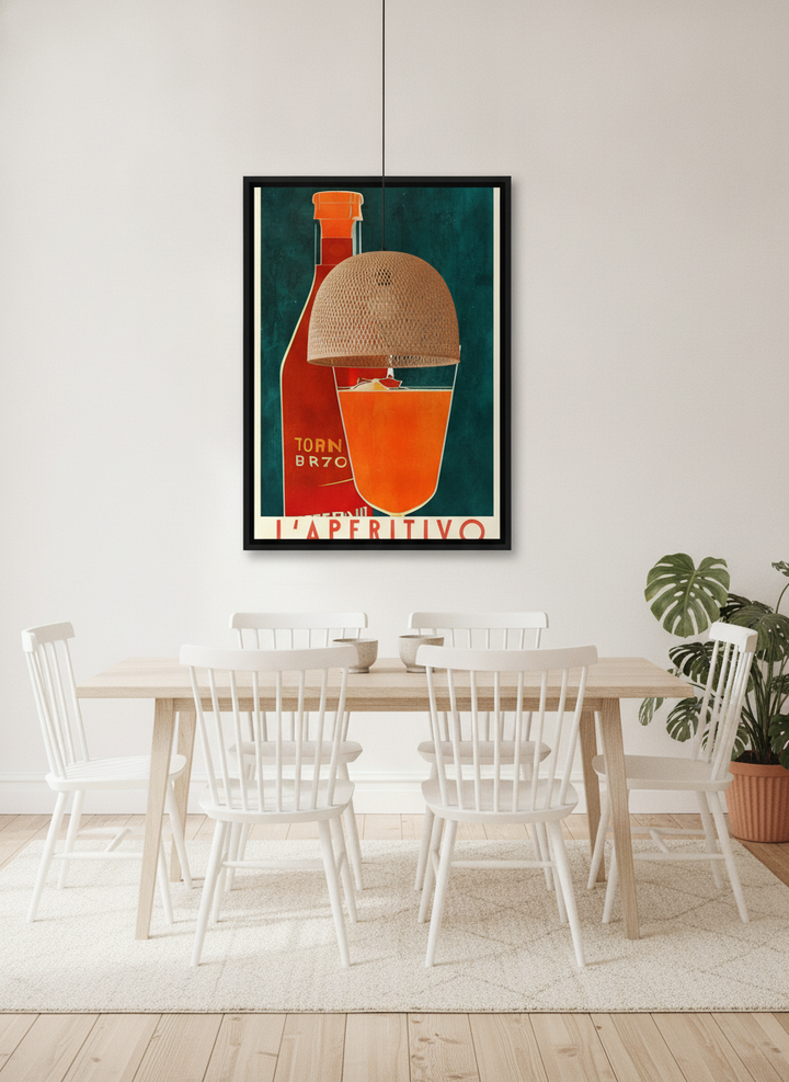 Canvas wall art with a black surround styled on the wall in a bright Scandinavian dining room