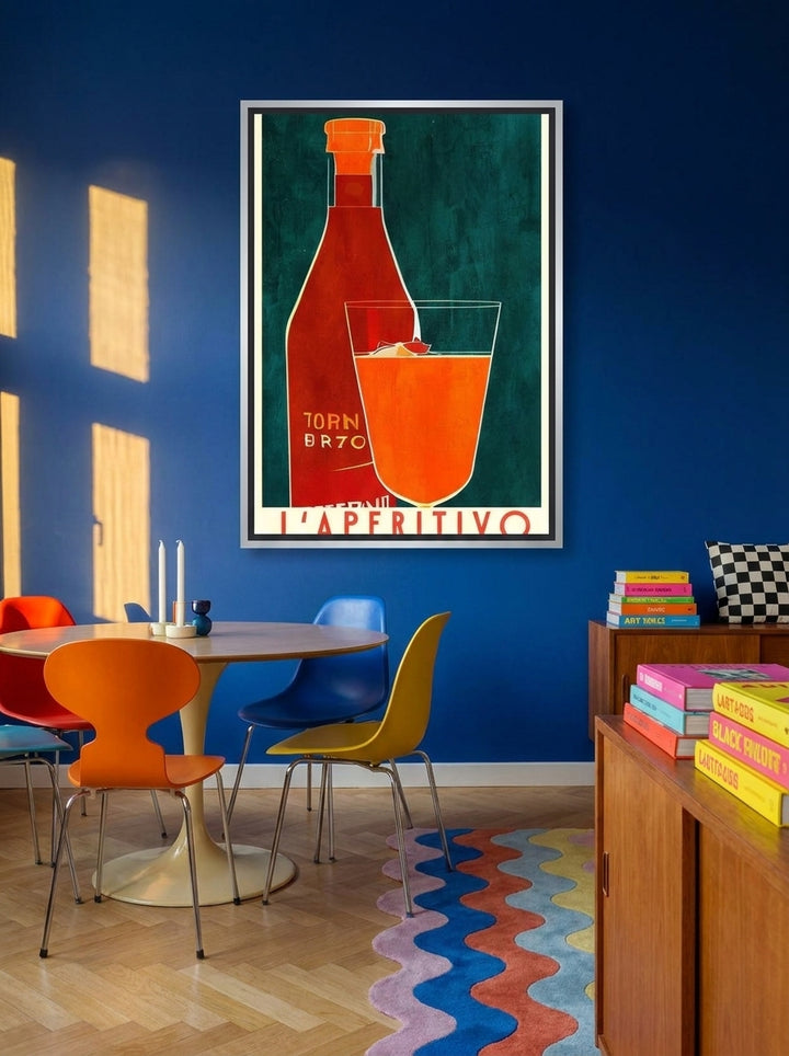 Canvas wall art with a silver leaf surround styled on the wall in a colourful eclectic dining room