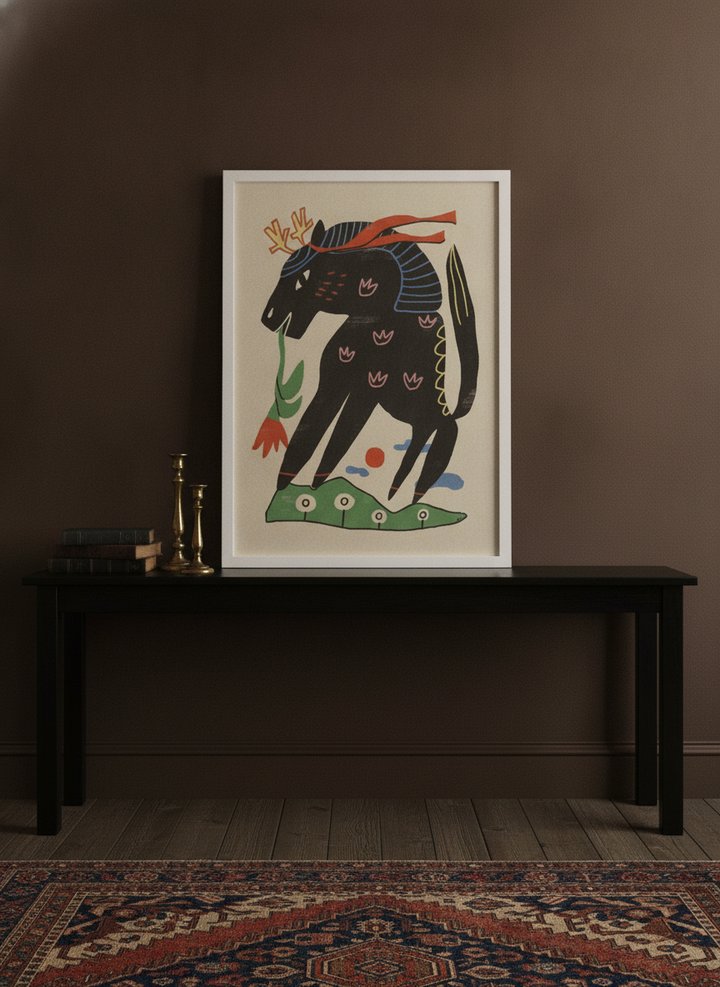 Modern wall art print standing on a console in a moody bedroom