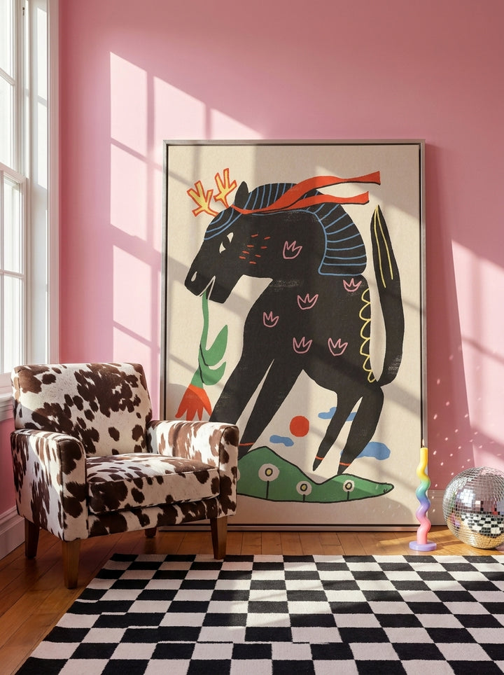 Oversized statement canvas wall art with a silver leaf surround leaning against the wall in a colourful eclectic bedroom