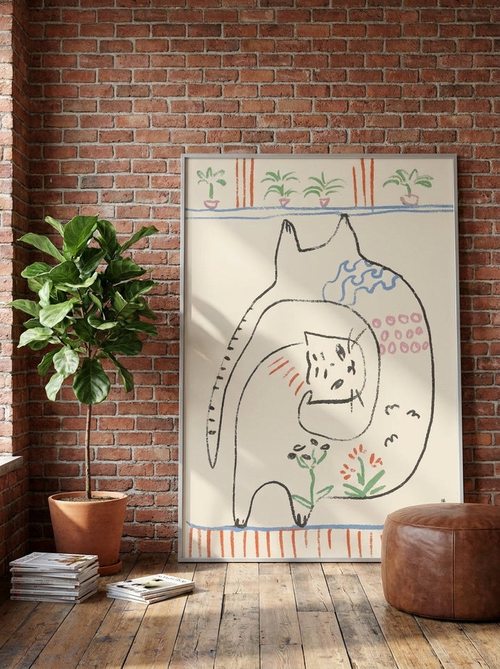 Oversized statement canvas wall art with a silver leaf surround leaning against the wall in an industrial loft living room