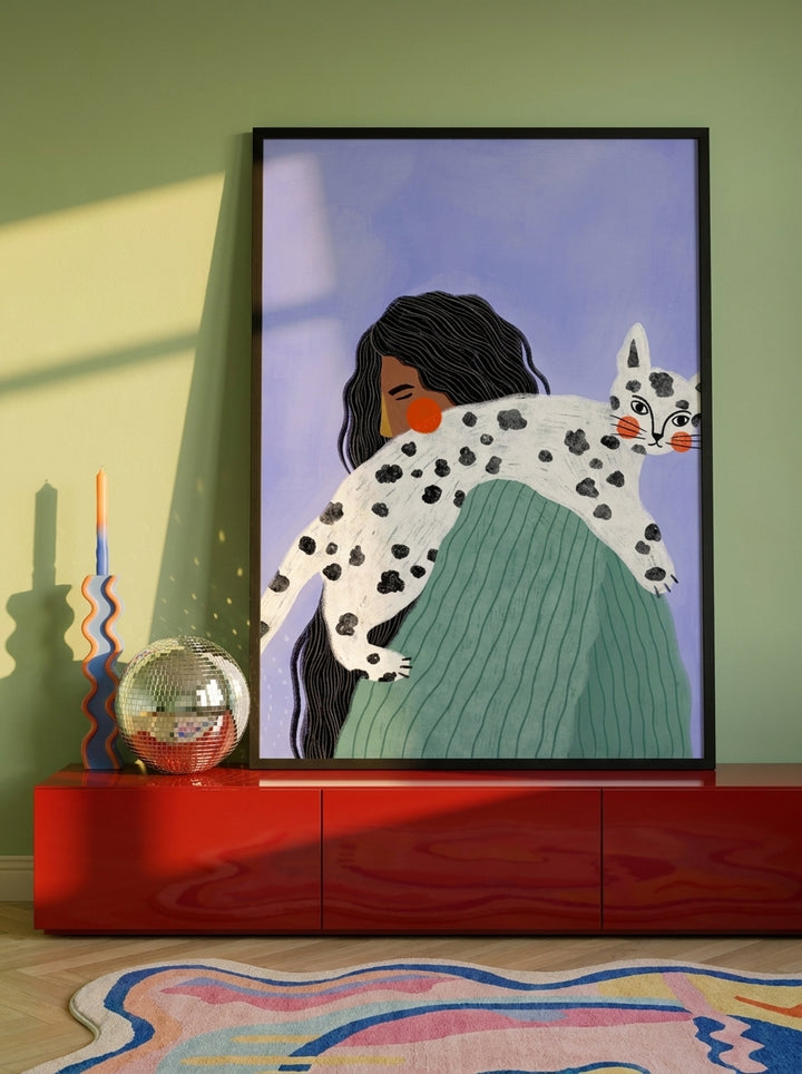 Modern wall art print standing on a sideboard in a colourful eclectic bedroom