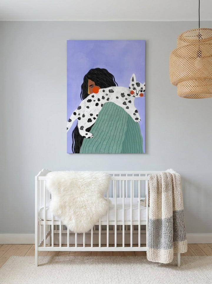 Stretched canvas wall art styled on the wall in a bright Scandinavian nursery