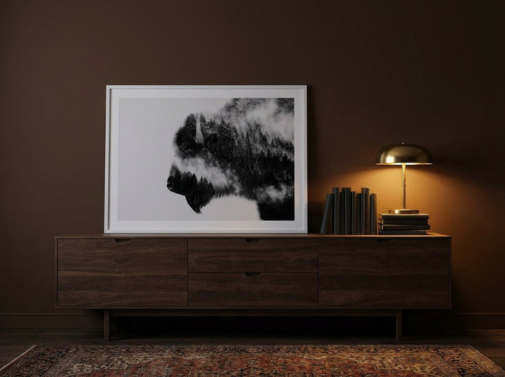 Modern wall art print standing on a sideboard in a moody bedroom