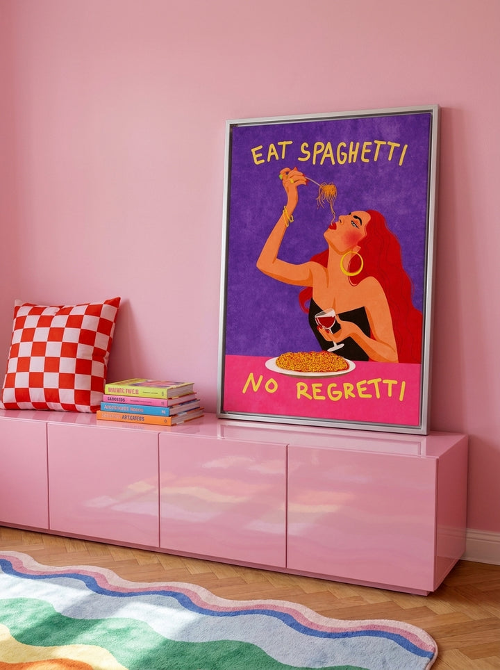 Canvas wall art with a silver leaf surround standing on a sideboard in a colourful eclectic bedroom