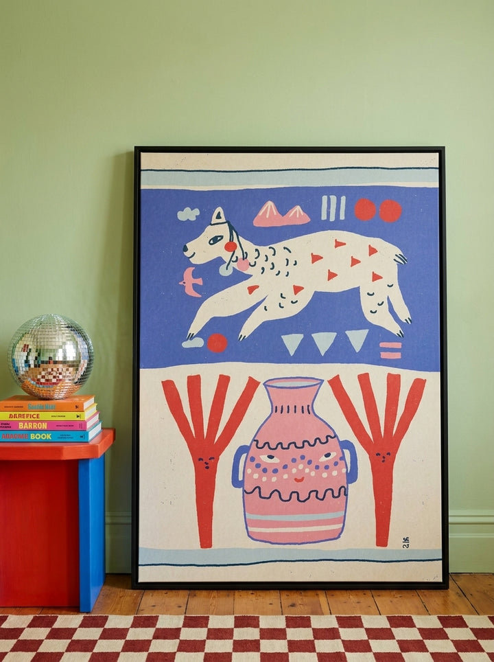 Oversized statement canvas wall art with a black surround leaning against the wall in a colourful eclectic dining room