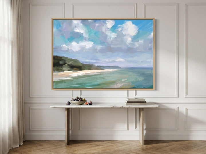 Oversized statement canvas wall art with a natural timber surround styled on the wall in a Parisian living room