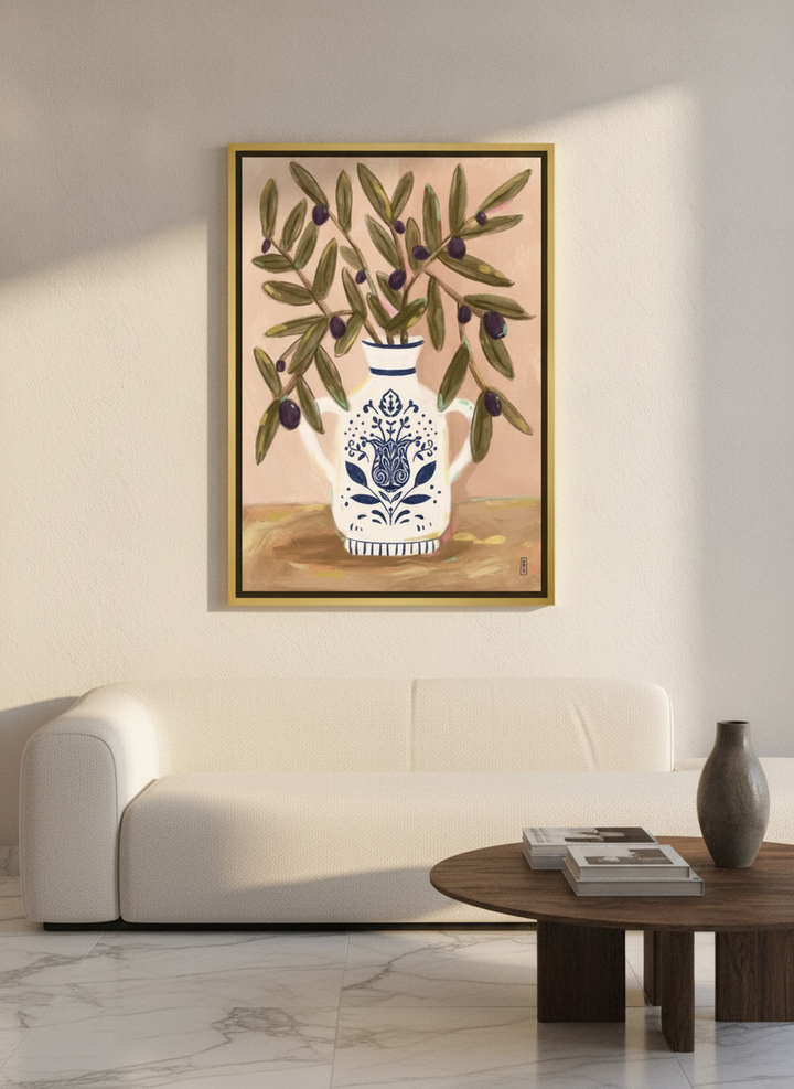 Canvas wall art with a gold leaf surround styled on the wall in a luxe living room