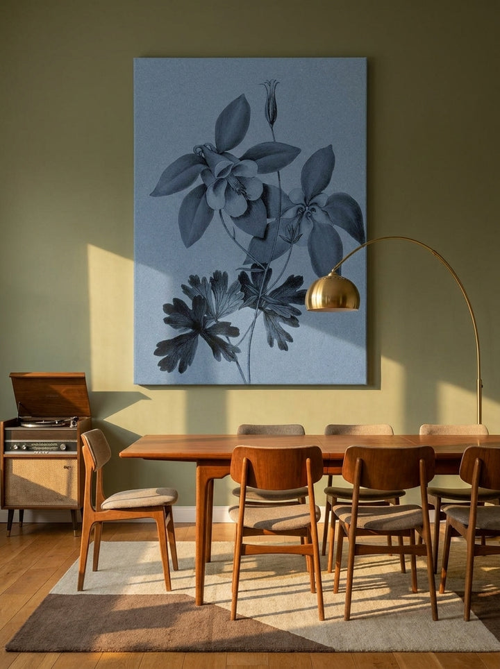 Stretched canvas wall art styled on the wall in a mid-century dining room