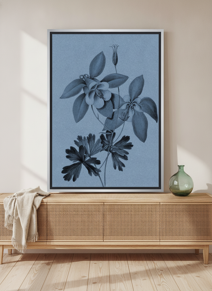 Canvas wall art with a silver leaf surround standing on a sideboard in a coastal bathroom