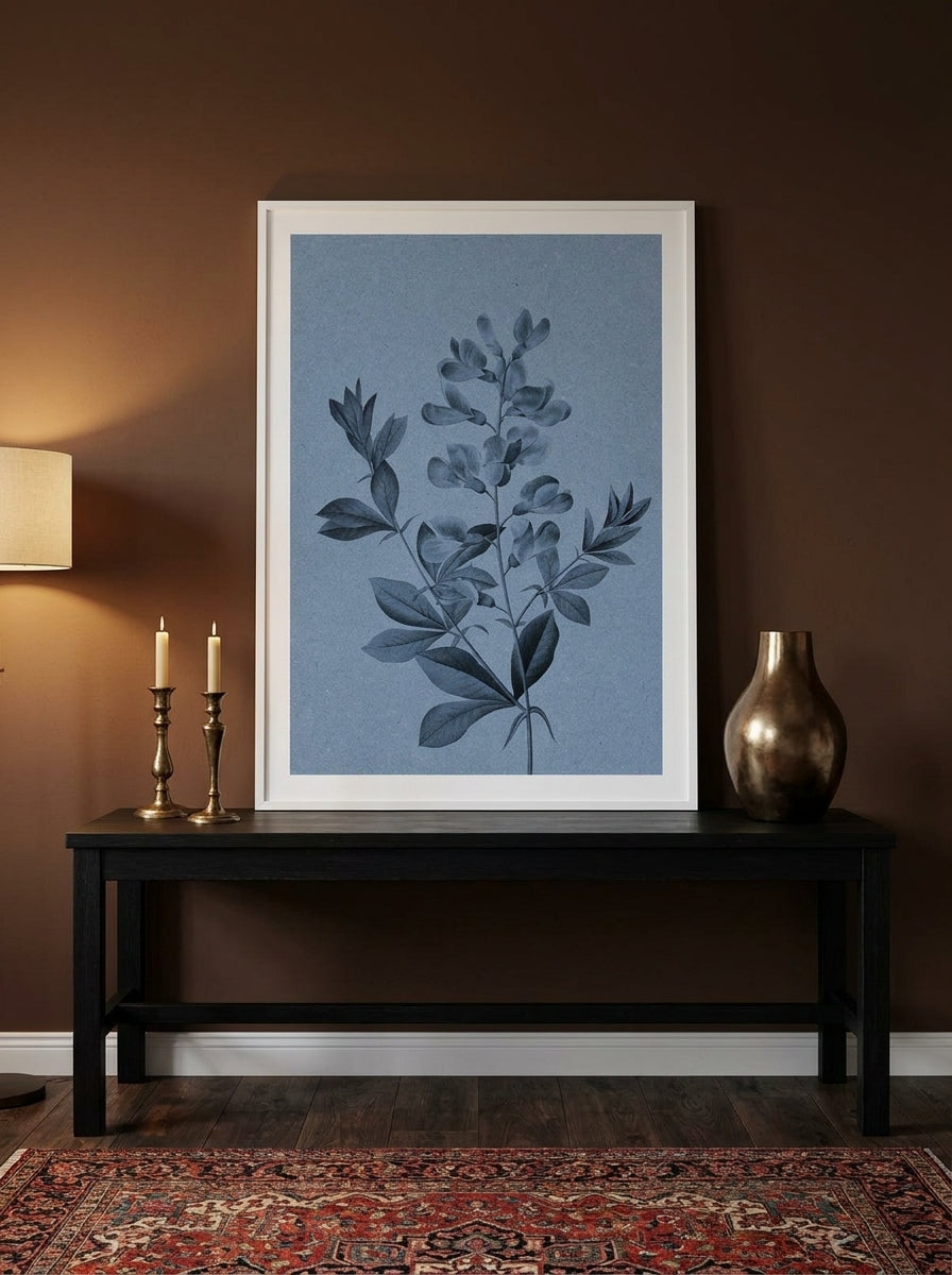 Modern wall art print standing on a console in a moody bedroom