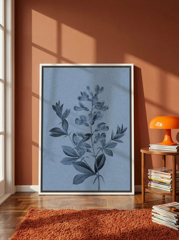 Canvas wall art with a white surround leaning against the wall in a retro 70s home office