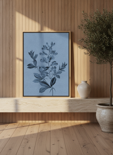 Canvas wall art with a natural timber surround standing on a console in a luxe bathroom