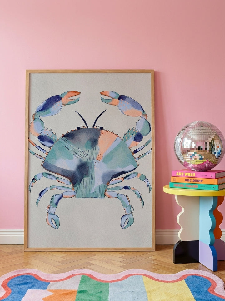 Oversized statement modern wall art print leaning against the wall in a colourful eclectic living room